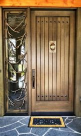 White Oak Entry with custom, bronze sidelight grills